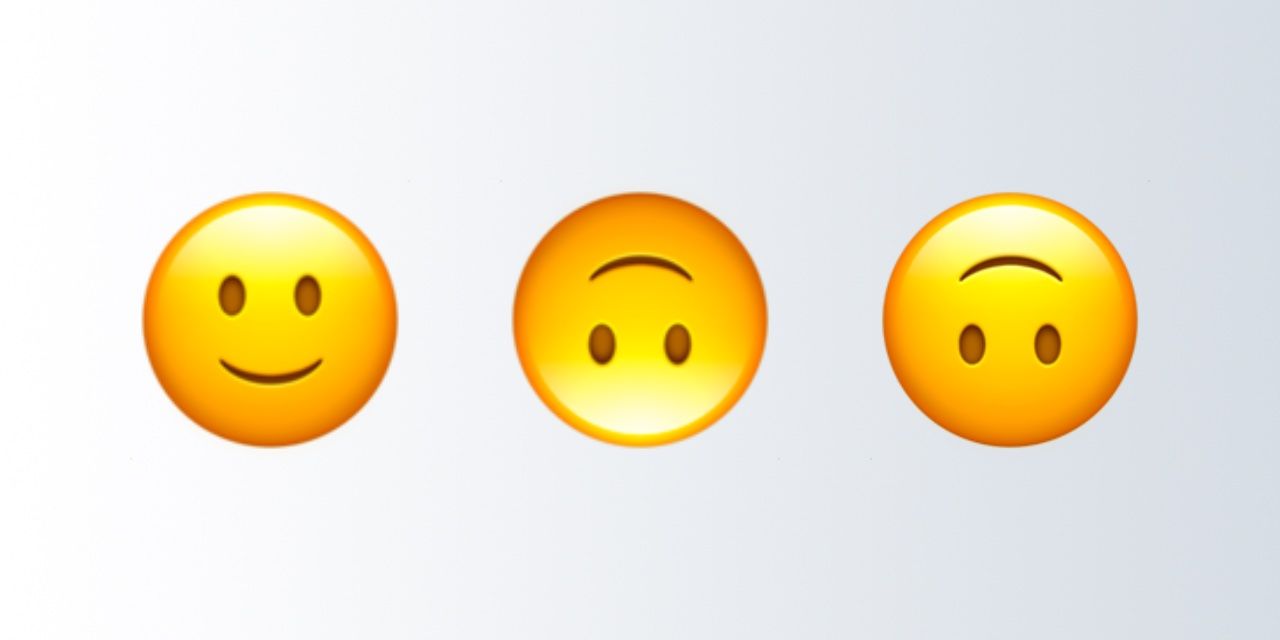 what does the upside-down smile emoji mean